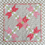 Crossing Petals Mini Quilt Pattern by Taunja Kelvington of Carried Away Quilting